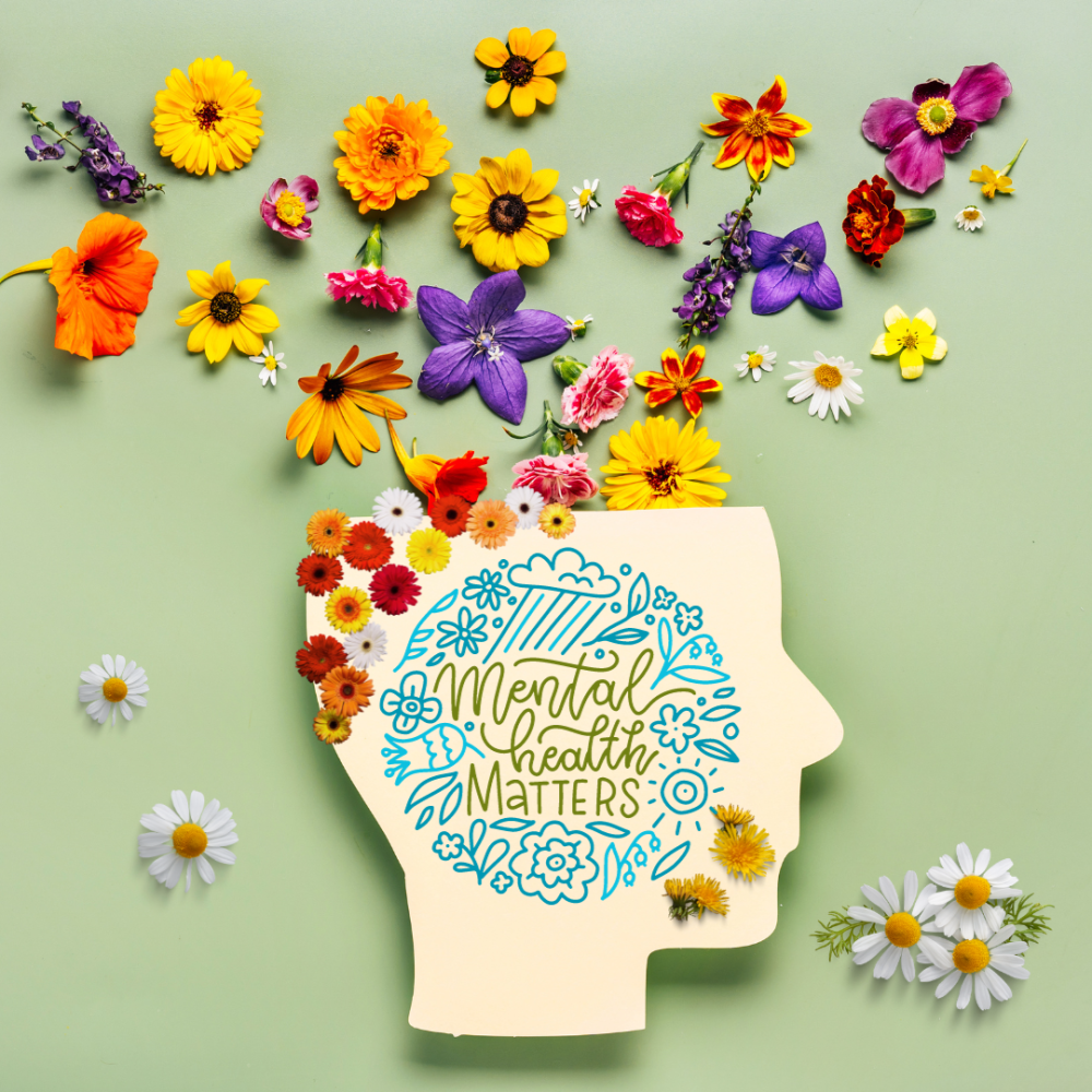 A colourful artistic illustration featuring flowers flowing from the top of a head, with the message Mental Health Matters below.